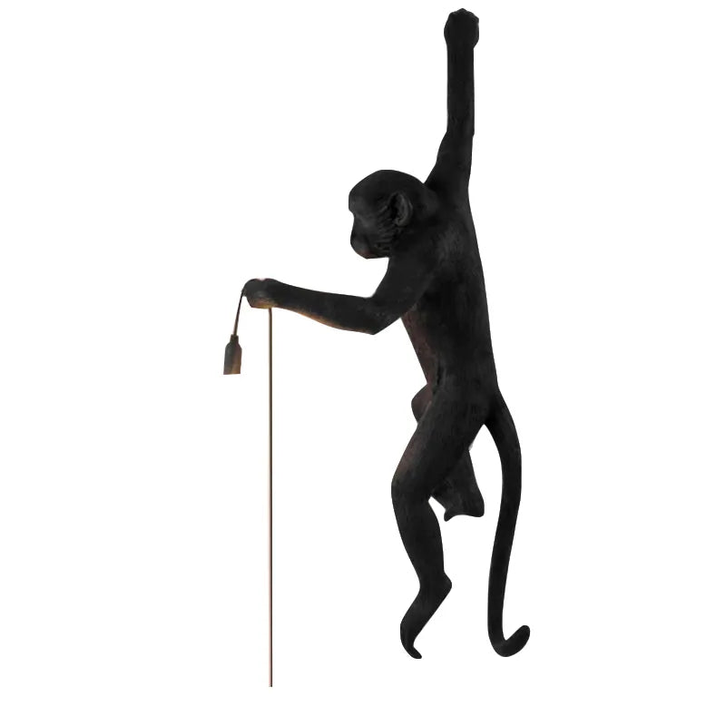 Lampa ścienna Monkey zapewniająca oświetlenie w sypialni